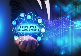Business, Technology, Internet and network concept. Young businessman working on a virtual screen of the future and sees the inscription: Employee engagement