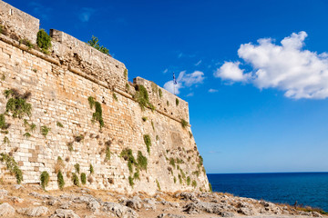 Fototapeta na wymiar The stone wall of ancient Fortezza in Rethymno city on Crete, Greece