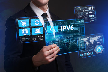 Business, Technology, Internet and network concept. Young businessman working on a virtual screen of the future and sees the inscription: IPv6