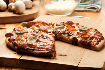 Slices of pizza with bacon, olives and jalapeno papper