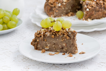 piece of delicious nut pie with grapes
