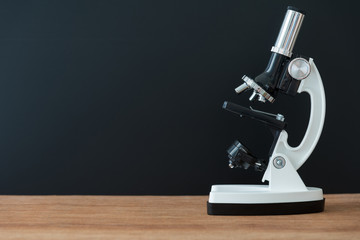 microscope on wooden table