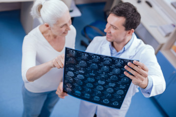X ray brain images being held by a professional doctor