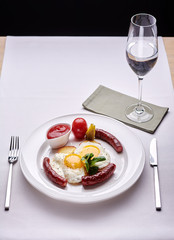 Delicious Omurice omelette with ketchup close-up on a plate. Horizontal