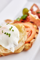 Delicious Omurice omelette with ketchup close-up on a plate. Horizontal