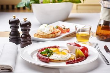 Delicious Omurice omelette with ketchup close-up on a plate. Horizontal