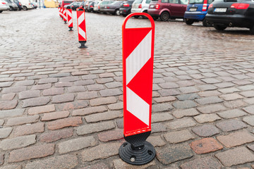 Vertical red and white striped caution road signs