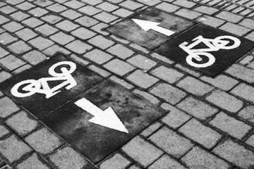 Bicycle lane, road marking with arrows and bike icons