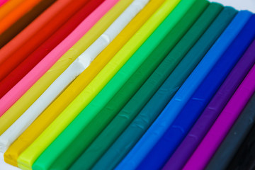 Set of plasticine palettes on white background. Rainbow colors
