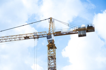 Abstract Industrial background with construction cranes silhouettes over amazing sunset sky