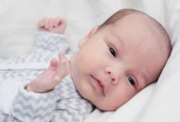 Newborn baby quiet looking, dark eyes