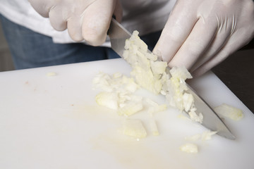 Fototapeta na wymiar Cook cuts onions