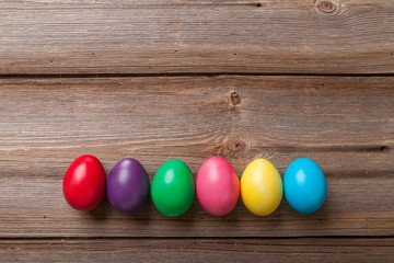 Colorful Easter eggs on old wooden background