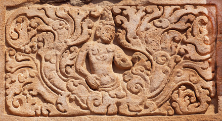 Example of Indian design of stone relief of 7th century temple in Pattadakal, India. UNESCO World Heritage site with stone carved temples.