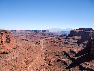 Dirt road viewed from plateau at Canyonlands National Park near Moab, Utah, United States