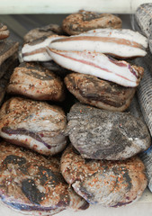 Bacon and cheek lard on market shelf