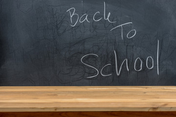 text back to school on blackboard or chalkboard