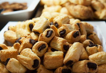 Chocolate mini rolls on a large tray at the breakfast bar
