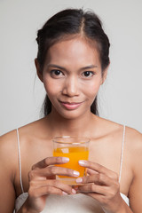 Young Asian woman drink orange juice.