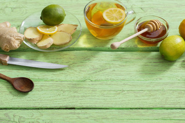  Ginger tea and ingredients on a  grunge wooden background