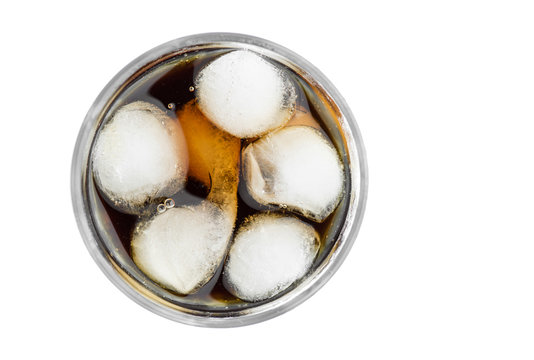 Top View Of Iced Glass Full Of Ice Cubes With Carbonated Refreshing Drink In It On White Background Closeup