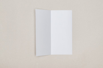 Trifold white template paper on grey background