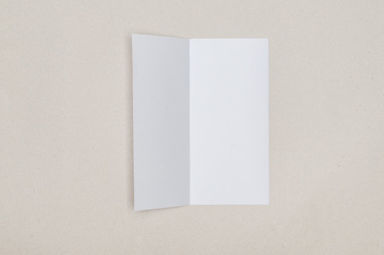 Trifold white template paper on grey background