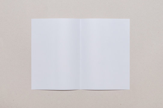 Bifold white template paper on grey background