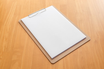 Wooden clipboard on wood background