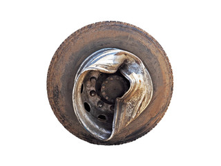 Dirty and broken tire truck wheel after the accident, damaged rim of the wheel of the truck, isolated on white background