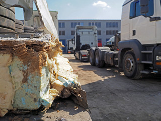 Truck trailer fragment (refrigerated) after an accident. Parking lot truckers