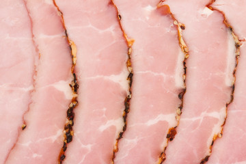 slices of smoked pork fillet pink texture background
