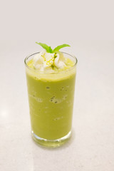 Green tea frappe, topping with peppermint leaf