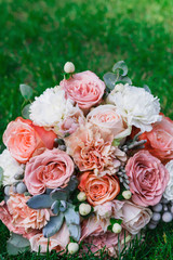 Wedding bouquet on grass with copy space