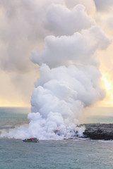 Naklejka na ściany i meble Amazing view of lava pouring into the sea in Volcanoes National Park, Big Island, Hawaii