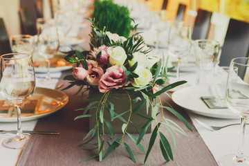 Served wedding table with flowers decorations