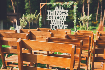 Wedding ceremony arch with flowers and greenery