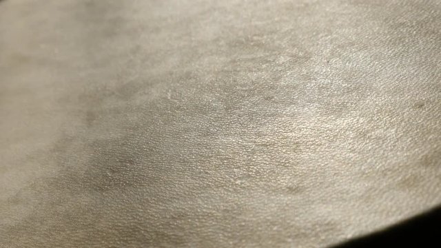 Slow pan over detailed goblet drum playing surface 4K 2160p 30fps UltraHD footage - Panning over fine leather membrane of tribal chalice tarabuka 3840X2160 UHD video 