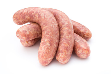 Raw sausage with parsley leaf isolated on white background.