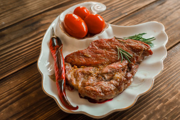 beautiful mesas tomatoes and rosemary on wooden background