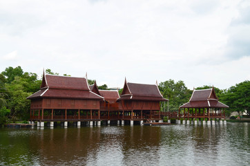 Fototapeta premium Group of beautiful traditional Thai house in pond