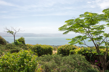Obraz premium View from the mount of Beatitudes on a misty Sea of Galilee with mountains in the background
