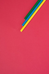 Crayon, green, yellow, blue, pink background