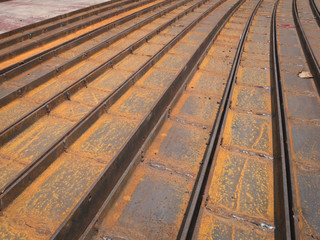 Close-up of rusty steel channel U-sections bunch in warehouse