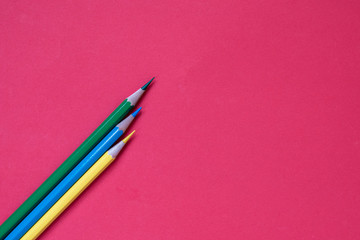 Crayon, green, yellow, blue, pink background