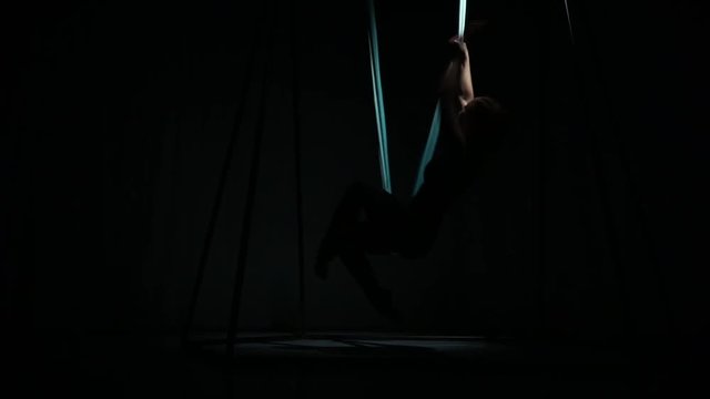 Young trainer shows exercises