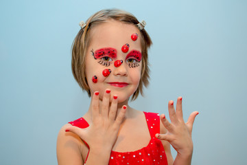 Little girl with ladybug face paint