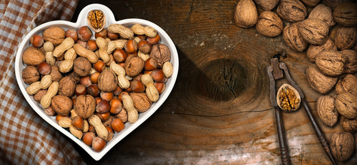 Dried fruits in a bowl in the shape of a heart - Healthy eating