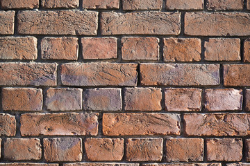 large street clocks on a brick wall