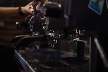 Fototapeta na wymiar barista is making coffee on coffee machine